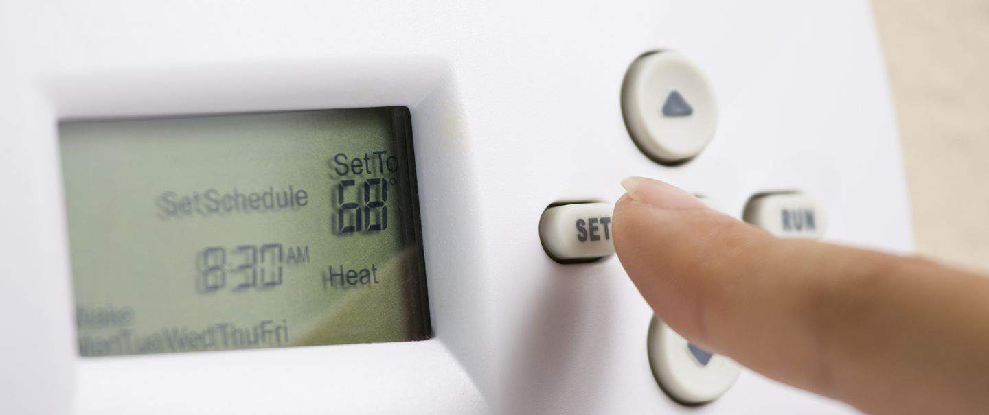 adjusting a thermostat