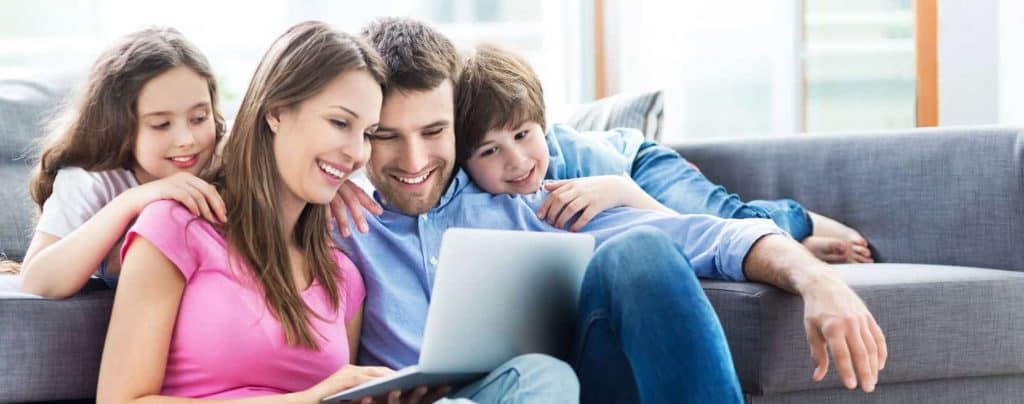 a family using a laptop